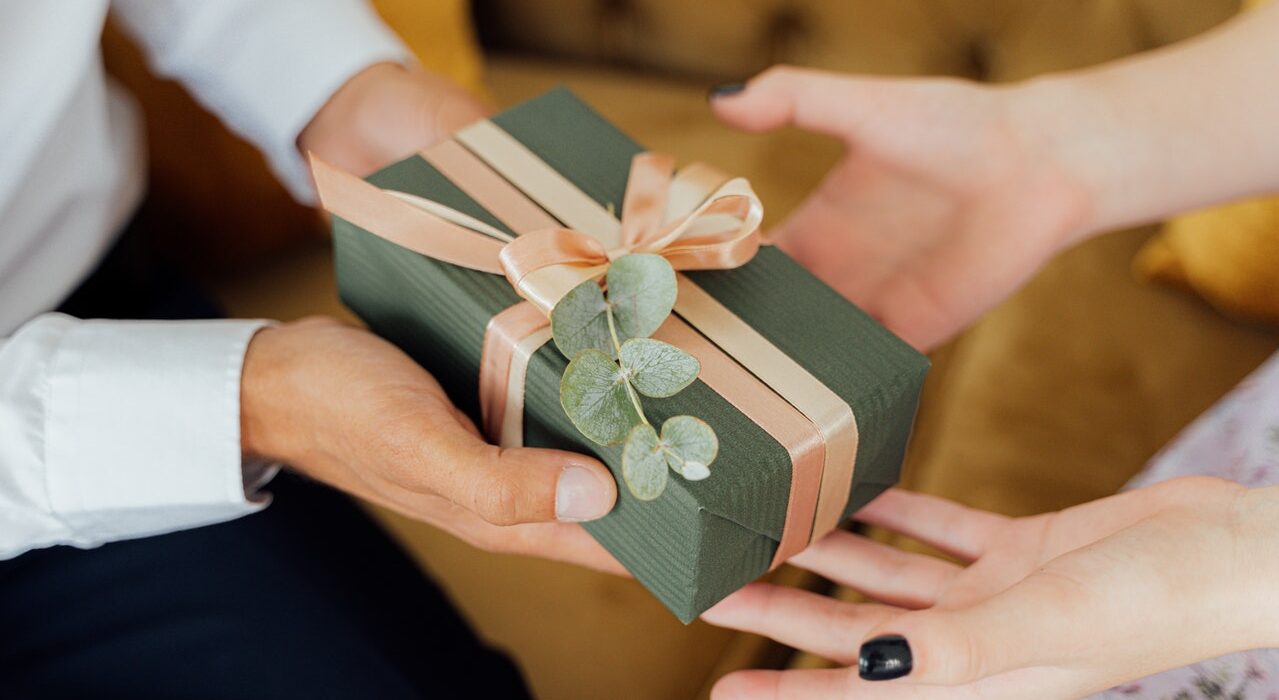 Photo by ANTONI SHKRABA: https://www.pexels.com/photo/person-giving-a-gift-box-5493207/