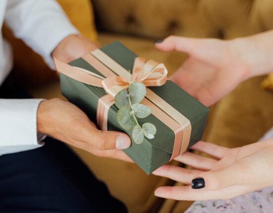 Photo by ANTONI SHKRABA: https://www.pexels.com/photo/person-giving-a-gift-box-5493207/