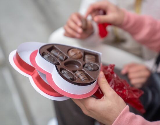 Photo by Budgeron Bach: https://www.pexels.com/photo/anonymous-guy-giving-sweet-candies-to-girlfriend-on-street-6533167/