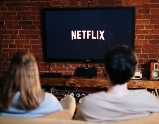 Photo by cottonbro: https://www.pexels.com/photo/man-and-woman-sitting-on-a-couch-in-front-of-a-television-4009402/