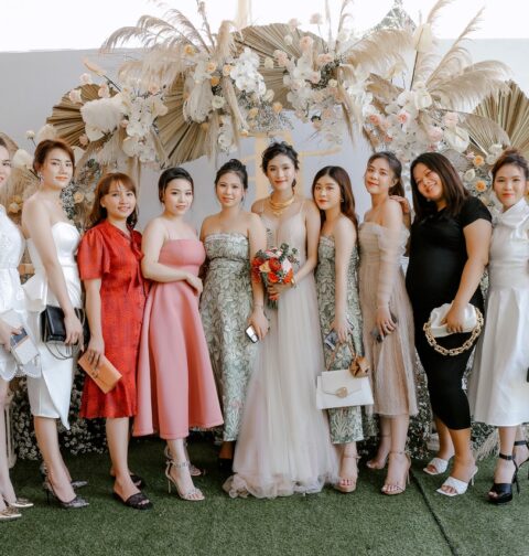 Photo by Trung Nguyen: https://www.pexels.com/photo/happy-bride-with-friends-on-wedding-celebration-5096322/