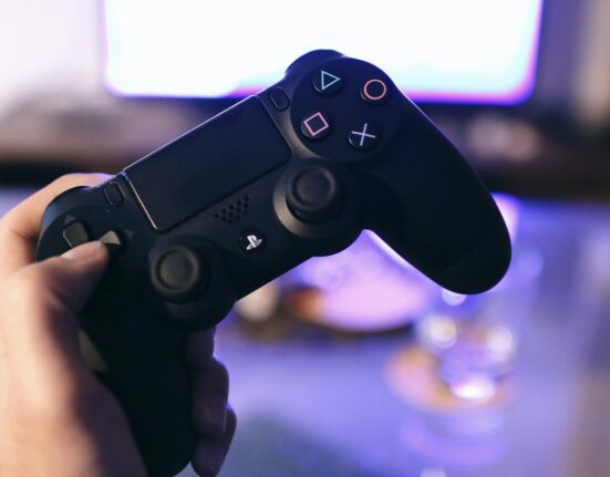 Photo by JÉSHOOTS: https://www.pexels.com/photo/person-holding-sony-ps4-dualshock-4-21067/