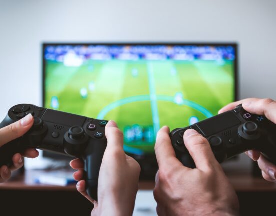 Photo by JESHOOTS.com: https://www.pexels.com/photo/two-people-holding-black-gaming-consoles-442576/