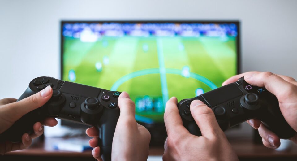 Photo by JESHOOTS.com: https://www.pexels.com/photo/two-people-holding-black-gaming-consoles-442576/
