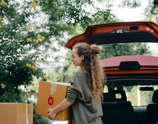 Photo by Ketut Subiyanto: https://www.pexels.com/photo/content-young-lady-unloading-carton-boxes-out-of-car-trunk-4246262/