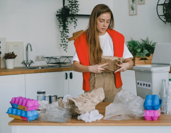 Photo by SHVETS production: https://www.pexels.com/photo/young-woman-sorting-trash-for-recycling-7512773/