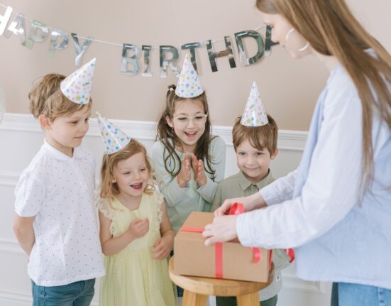 Photo by Thirdman: https://www.pexels.com/photo/a-woman-opening-a-box-with-red-ribbon-7600324/
