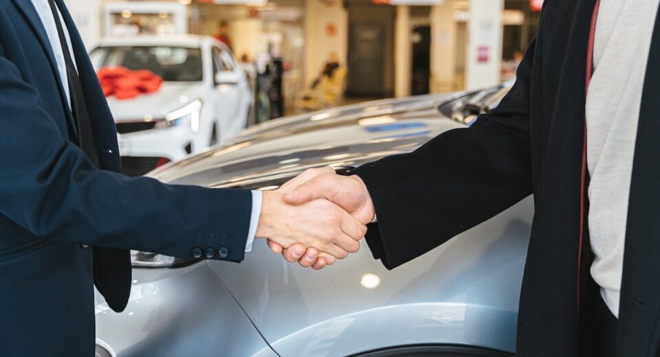 Photo by Antoni Shkraba: https://www.pexels.com/photo/close-up-of-men-shaking-hands-and-cars-in-background-7144199/